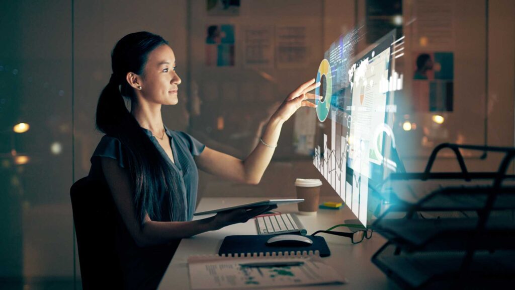 Shot of a young programmer using a digital tablet and computer at night in a modern office. competitive intelligence, m360 research