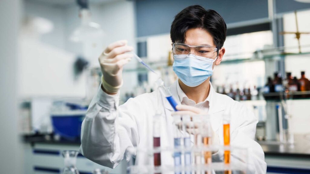 one asian male scientists work in laboratories