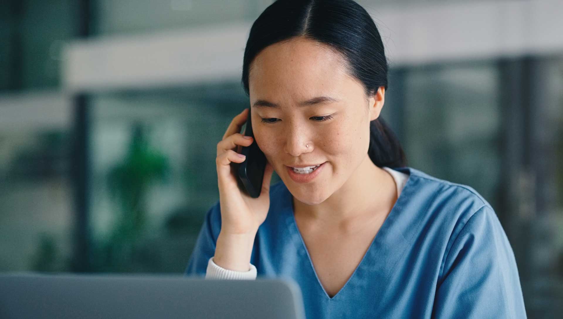 Woman nurse, phone call and laptop for communication, online consultation and medical research. Face of asian healthcare professional talking and planning surgery with health insurance and telehealth. m360 research. phone recruitment